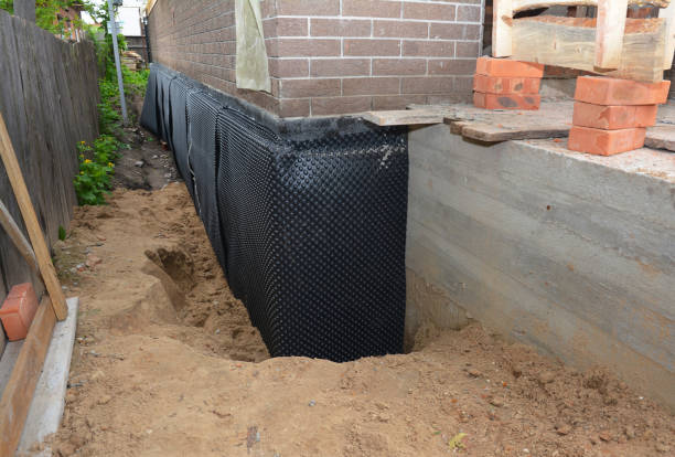 Happy homeowners after waterproofing job in Chesaning